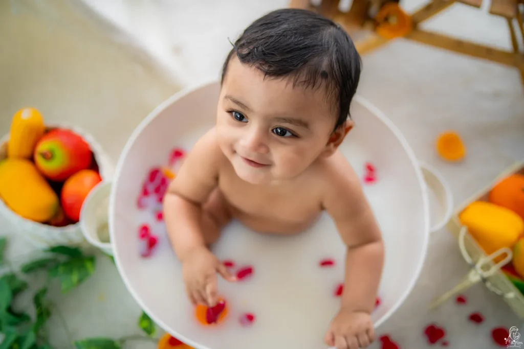 Professional baby photography session featuring a smiling baby at Me & Mom by DB ARTWORKS baby photography studio in Pune.